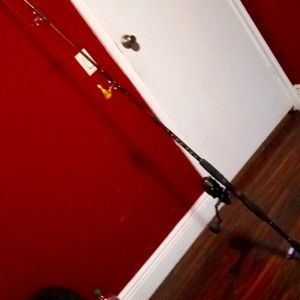 Mint condition ht 100 reel fishing rod.perfect condition